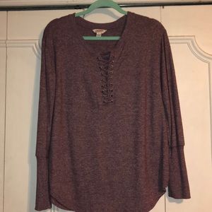 Purple long sleeve top.